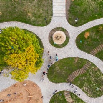 Aerial view of path radiating from a centre point with grassland between the paths Aerial view of path radiating from a centre point with grassland between the paths