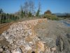 River bank protection with large bolder riprap and riparian forest restoration using 200 poplar trees.